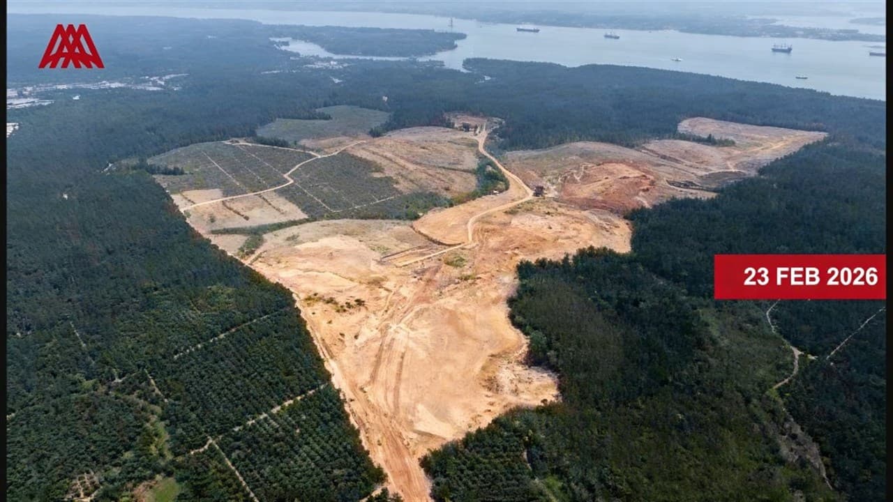 Alpha Austin Industrial Park (AAIP) at Tanjung Langsat — aerial site progress as at 23 February 2026, with earthworks and land clearing visible